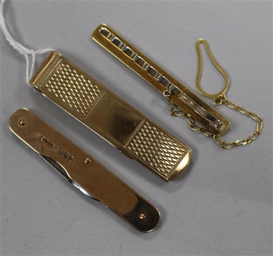 Two 9ct gold tie clips and a 9ct gold mounted penknife.